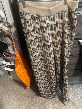 PLT Logo Knit Wide-Leg Pants in Beige and Black